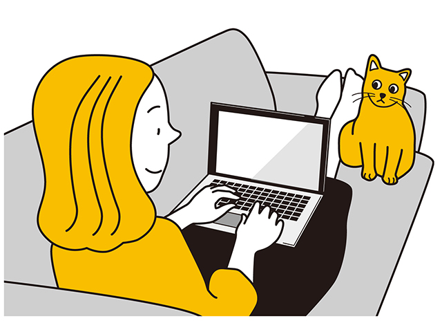 パソコンに向かう女性と猫